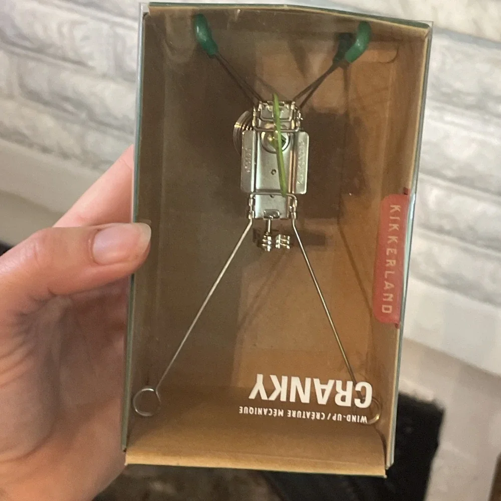 NIB kikkerland Windup Cranky Green Metal Creature Jittering Moving Paper Holder